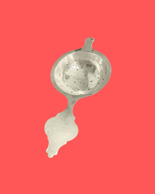 THE TEA STRAINER